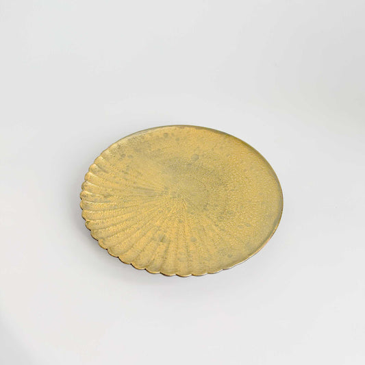Gold circular object on a white background