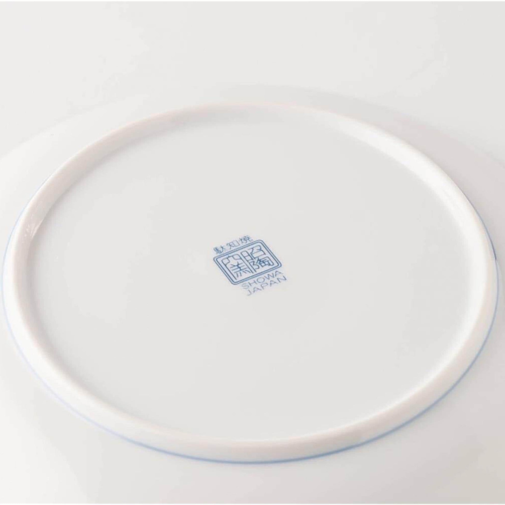 White ceramic plate with a blue logo on a white background
