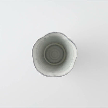 White ceramic cup on a light gray background