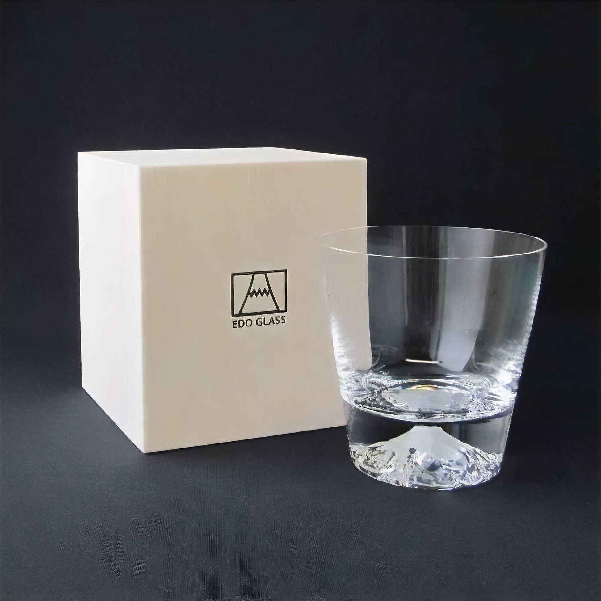 Clear glass tumbler with Edo Glass box on a dark background