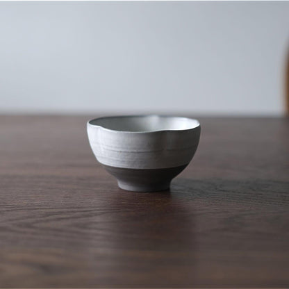 Ceramic bowl on a wooden table with a neutral background