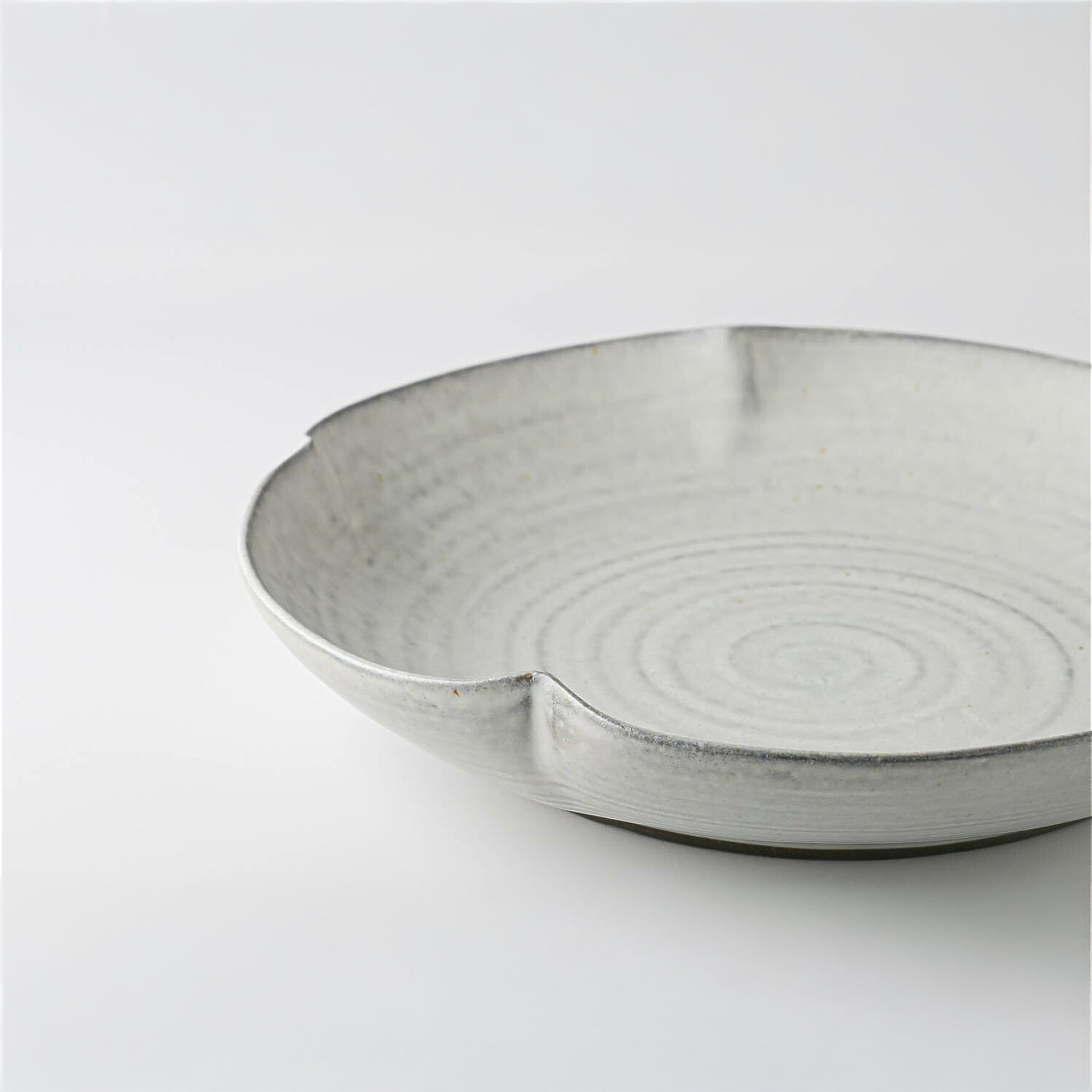 Gray ceramic bowl on a white background