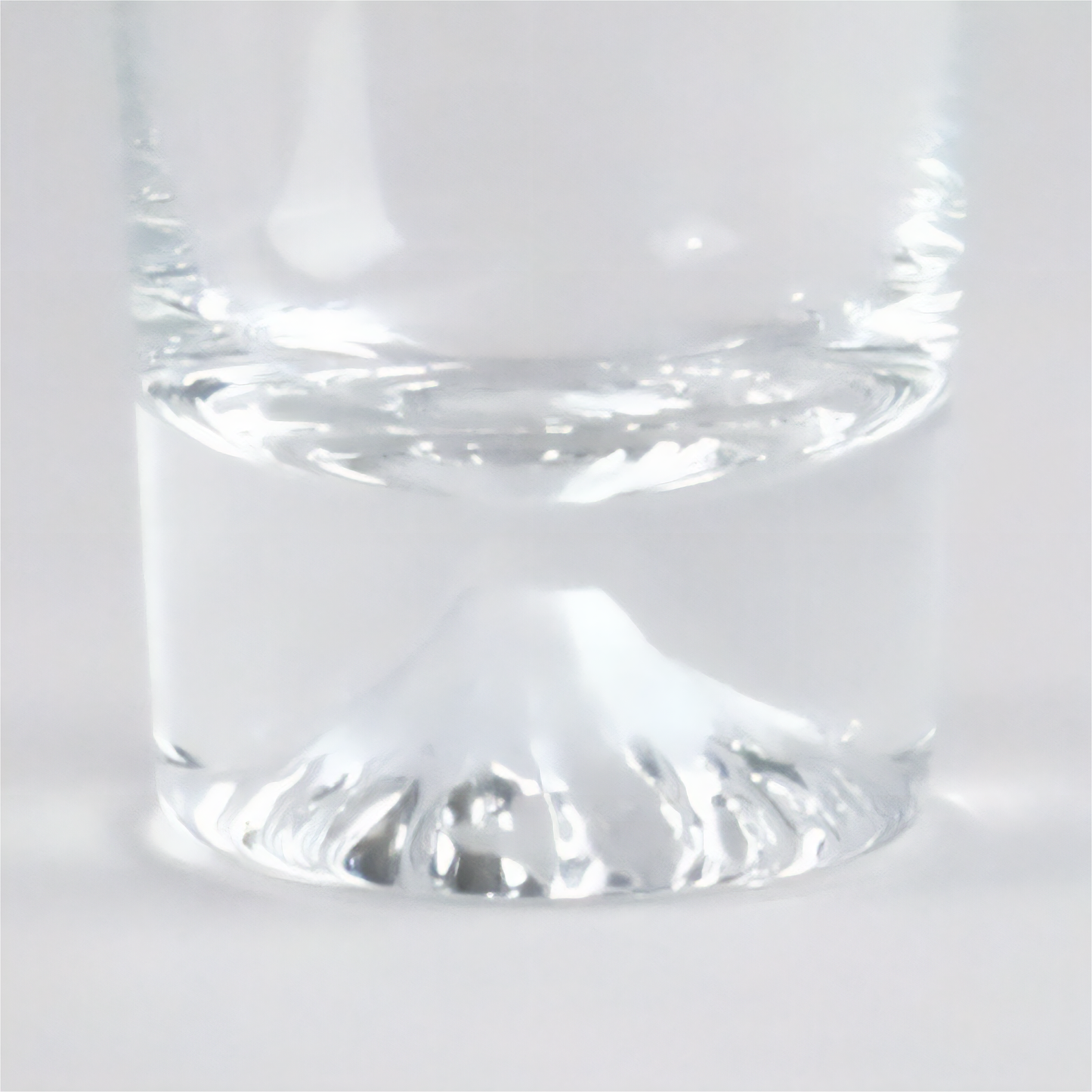Clear glass tumbler on a white background