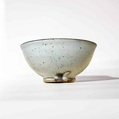 Handmade V-Shape Bowl with kohiki glaze, made of ceramic, on a white background.