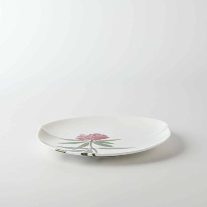 Side view of 6-inch white Mino ware plate with Yezo hydrangea botanical design.