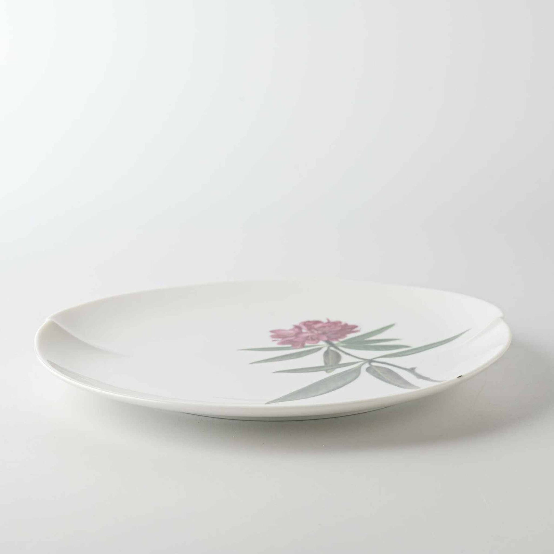 A white, 8-inch porcelain plate with a delicate Yezo hydrangea design.
