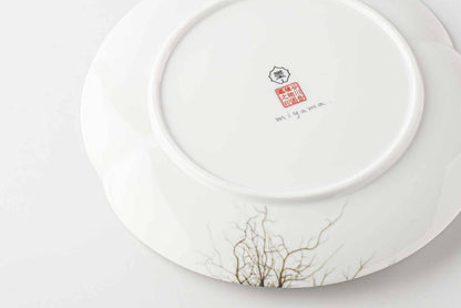 A white, delicate, and intricately designed 8-inch porcelain plate with a botanical design, inspired by the natural beauty of Mount Tanigawa.