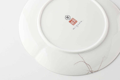 A white, delicate, and intricately designed 8-inch porcelain plate with a daisy motif, made of Mino Ware, a traditional Japanese ceramic.
